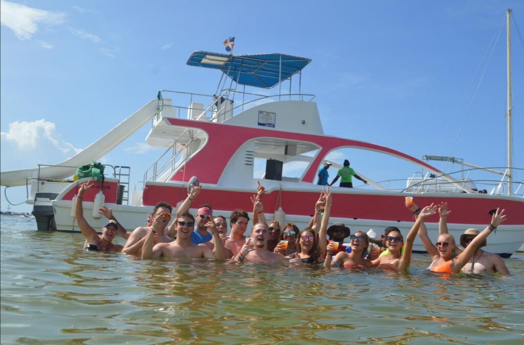 a group of people on a boat in the water