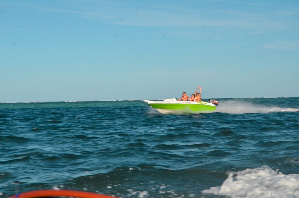 Green Speedboat in Water